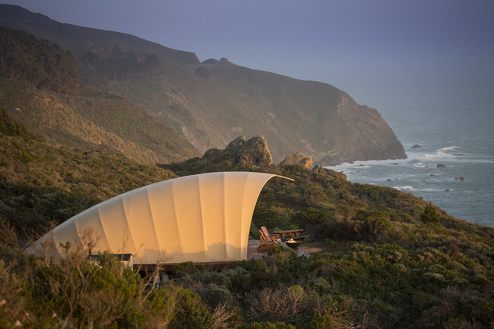 One of the tenets of Treebones Resort is to build shelters that perch lightly on the land. The Autonomous Tent doesn't require a foundation, instead resting on a deck that is held to the ground with screws.