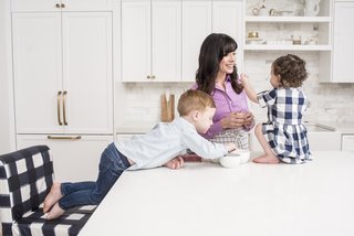 An Interior Designer's Streamlined Kitchen - Photo 1 of 7 - "Our kitchen really is the room in the house we spend most of our time in," says Wilson, whose three children are Olivia, Penn, and Chloe. Being a mother has been a source of inspiration for designing beautiful and functional spaces. 