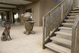 Setting Creative Solutions in Stone - Photo 3 of 6 - Offering 12 standard colors and a wide assortment of finishes across its product lines, Stepstone allows customers to employ a seamless material palette, as seen in the CalArc Pavers and open riser Steptreads pictured in the home above. Stepstone also offers customizations made in collaboration with architectural and landscape design communities. 