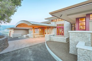 An Architectural Feat in Silicon Valley Tames a Rocky Landscape - Photo 3 of 8 - A redwood barrel vault entryway invites visitors to the house. An impressive feature that transitions from outdoor to indoor space, it posed a technical challenge. "Without much trim above or to the sides, the window fit really tightly into this arched entry," says Yaconelli. Kolbe Windows & Doors created the custom entryway to offer a personalized experience of coming home for the Haas family and guests.