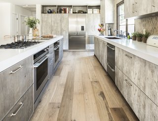 Though Capo suggested installing the ovens higher on the wall, their lower placement felt not only more intuitive to Lefebvre, but also safer. "It is important for me that my oven be located directly below my cooktops, so I don't have to wander around the kitchen with a hot pan and run the risk of spilling hot ingredients," explains Lefebvre. The DishDrawer, located under the sink, features two pull-out drawers and extra height on top to accommodate larger dishes. 