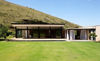 Herman and van Gass chose only natural materials like glass, steel, and stone, and designed the house to harvest its own water supply.
