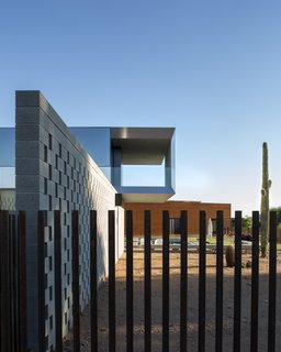 This Sleek Desert Home Seems to Melt Into the Sky - Photo 10 of 12 - The client is a motorcycle enthusiast and keeps his equipment in the garage, which is clad in weathering steel and acts as a southern wall.