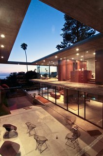 This Architect's Home Embraces Oceanfront Views - Photo 6 of 7 - Though the house is made of interior and exterior volumes, the vertical walls and roof planes maintain the four corners of its rectangular form.