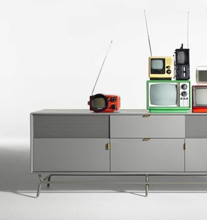 Democratizing Design With a Dose of Humor - Photo 8 of 9 - The perforated steel door of the Dang 2 Door / 2 Drawer Console accommodates remote controls while maintaining a clean aesthetic.