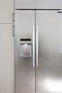 A Sneak Peek Into an Interior Designer's "No Ordinary Kitchen" Renovation - Photo 6 of 8 - Lewis also installed the 42" Built-In Side-By-Side Refrigerator, which features a SmartSpace™ system that embeds the ice dispenser in the freezer door, freeing up storage space. The adjustable cantilevered shelves add even more capacity and move with a touch of a button. In keeping with the sleek aesthetic of the kitchen, the fridge also has an LED touch control panel. Lewis can use her phone to monitor energy use, delay defrosting, and check on the fridge's performance with Smart Diagnosis.