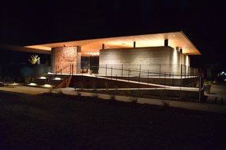 The Clubhouse holds the reception desk, spa-inspired bathrooms and showers, the Canteen, and lounge areas. During inclement weather, a curtain encloses the open pavilion like tent walls. 
