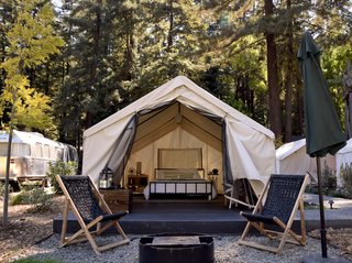Outside each tent is a patio area outfitted with lounge chairs and a fire pit. At night, an electric blanket keeps things toasty.