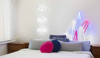 Next-Generation Neon - Photo 3 of 7 - Eye! Eye! Eye! ($449) and Crystal Prism ($449) decorate a bedroom. Electric Confetti's designs come with a remote control that allows you to dim the neon to less than 5% brightness, ideal for a nightlight, or set it to an adjustable flashing speed.