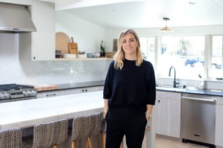 The Big Reveal: An Interior Designer Unveils Her “No Ordinary Kitchen” Makeover - Photo 1 of 9 - As a child, Lewis would accompany her father on construction site visits, an experience that kindled her interest in interior design and home renovation. Following a stint in fashion school, a few semesters in the UCLA interior design program, and a gig as an assistant at an interior design firm, Lewis launched her own business. The rest, as they say, is history: Amber Interiors is now a design-build firm with clients all across the country. Lewis’s distinctive aesthetic favors clean white walls, colorful textiles, brushed metals, and nature. With a robust online following, she has also launched a furniture and home goods line, an e-commerce business, and a brick-and-mortar store.