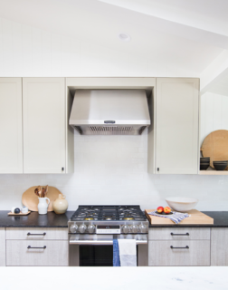 The Big Reveal: An Interior Designer Unveils Her “No Ordinary Kitchen” Makeover - Photo 3 of 9 - A 30" Gas Slide-In Range and 30" Hood deliver powerful results. The stovetop’s brass RapidHeat™ burners don’t just add metallic flair—they reach up to 18,500 BTUs for quick and powerful heat, saving prep time in the kitchen. The oven comes equipped with professional ProHeat™ Convection technology, which evenly distributes heat for sumptuous, perfectly cooked meals, and when it comes time to check on the food, the Easy Swivel Handle™ prevents your hand from getting burned on the door. Above, the hood features an LED light control display, 4 fan speeds, and a clean filter indicator.