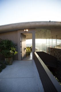 A Nest Cam Outdoor perches above the entrance to the home. Designed to weather any climate, the camera streams 130 degrees of high-definition video 24/7. Advanced algorithms detect activity, and homeowners can even receive special alerts when the camera sees a person.
