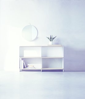 A Round Metal Shelf Mirror ($69.99) provides a small catch-all storage solution above a Bookshelf ($249.99) which combines open and closed backing.