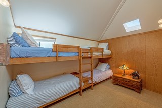 Settle in the Celebrated Sea Ranch For Under $2.9M - Photo 9 of 11 - A bunk room in the guest wing sleeps four, ideal for family reunions or bigger groups.