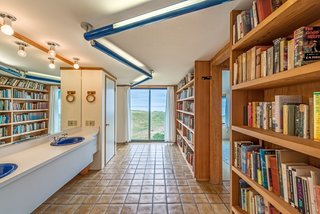 Settle in the Celebrated Sea Ranch For Under $2.9M - Photo 10 of 11 - In keeping with Moore's whimsical design sense, a guest bathroom has its own library.