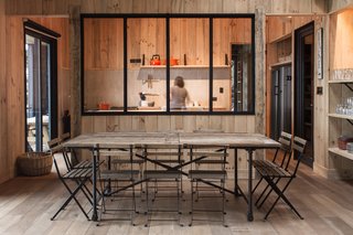 Just Getting to This Remote Patagonian Retreat Is an Adventure - Photo 4 of 8 - Pine wood "tejuelas," or planks used for cladding and ceilings, wrap the entire interior in keeping with the Southern Chile regional vernacular. Its muted tones speak to the surrounding environment as well.