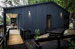Just Getting to This Remote Patagonian Retreat Is an Adventure - Photo 2 of 8 - Modular corrugated steel protects the house against year-round rain. Home automation company Home Control outfitted the residence with energy-efficient LED lights and zone-specific audio systems.