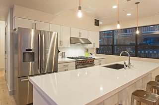 Be at Home With Park City’s Slopes For $1.6M - Photo 4 of 8 - The kitchen boasts white quartz countertops and stainless steel appliances.