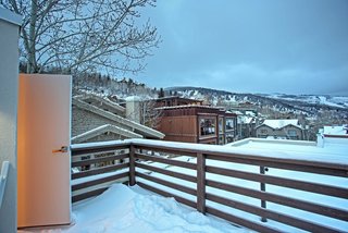 Be at Home With Park City’s Slopes For $1.6M - Photo 8 of 8 - The master bedroom enjoys access to the upper deck. "It’s tough to beat the rooftop view," says Preston. "It almost rises above the surrounding neighborhood."