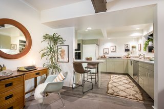 A Modified A-Frame Overlooking Los Angeles Starts at $699K - Photo 7 of 9 - The living room leads to the kitchen, which features a pony wall for bar seating.