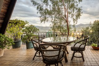 A Modified A-Frame Overlooking Los Angeles Starts at $699K - Photo 5 of 9 - The semi-sheltered terrace allows for outdoor dining with views of the surrounding neighborhood and nearby mountains.