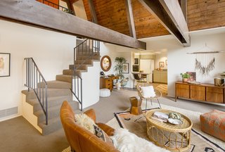 A Modified A-Frame Overlooking Los Angeles Starts at $699K - Photo 3 of 9 - Descending the staircase, you enter the open living area. Says the seller's son of the 1,701-square-foot space, "It's humble in size, but grand in its impact."