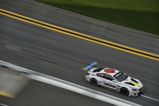 John Baldessari Blazes a Trail at the Daytona International Speedway With BMW Art Car #19 - Photo 5 of 11 - The image of a car appears on one side of the BMW Art Car #19, using two- and three-dimensional elements to add ambiguity to the work. "Considering the car as an icon of contemporary life, my concept turned out playfully satirical," says Baldessari.