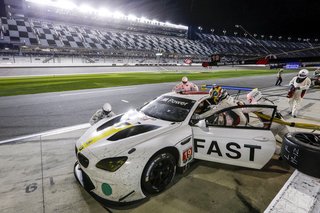 John Baldessari Blazes a Trail at the Daytona International Speedway With BMW Art Car #19 - Photo 10 of 11 - "You’re asleep at 4:30 in the morning, and someone wakes you up in the motorhome and says you need to be in pit lane," says driver Alexander Sims. "You rush up there, and there’s a yellow, and you get in sooner than expected. Now you’re doing 180 miles an hour when you were asleep 30 minutes before. So that’s the strange and difficult part of an endurance race—getting your mind ready to jump in." 