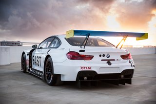 John Baldessari Blazes a Trail at the Daytona International Speedway With BMW Art Car #19 - Photo 3 of 11 - Race cars in the GTLM category typically have red mirrors, rear wing end plates, and windshield banner, but an exception was made to accommodate Baldessari's design vision.