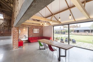 10 Dwell-Approved, New-Old Homes in the UK - Photo 18 of 18 - The dining room looks out at the front courtyard. Working with the original openings, Nossiter set the doors back from the external wall line.