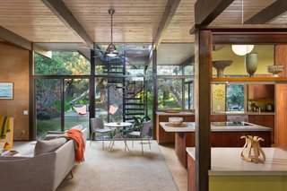 Snag This Midcentury Stunner in Southern California For $799K - Photo 3 of 10 - The kitchen and den, pictured above, as well as the living room and covered veranda open up to the backyard thanks to large glass walls. The rear of the house was rebuilt by architect Rufus Turner following a fire in the living room in 1964.