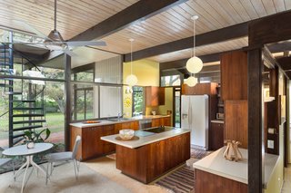 Snag This Midcentury Stunner in Southern California For $799K - Photo 5 of 10 - Carpeting, cork, and tile flooring run throughout the house, which is T-shaped in floor plan.