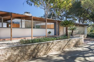 Originally sited on 14 acres of avocado and lime trees, the 2,580-square-foot residence was designed by Richard Neutra for James Roberts, a successful businessman in the manufacturing business, and his wife in 1955. A horse and several sheep roamed the property. Listing agent Nate Cole shares this anecdote: "Mrs. Roberts was an avid golfer, and she enjoyed driving golf balls out into the surrounding orchards. She would apparently send the kids out with buckets to retrieve them."
