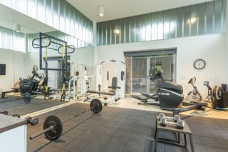 Currently, the pool house is set up as a home gym.