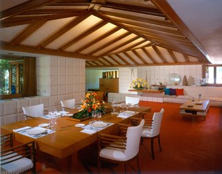 A red-orange carpet sets the stage for the dining area. Here, Dow taught his children lessons about honesty, humility, and enthusiasm—three values integral to all structures. Honesty refers to the straightforward use of materials to meet a need, while humility encourages a balance between buildings and their surrounding environment. Enthusiasm is "the real life-giving property...the quality that makes buildings more than a box," expressed Dow.