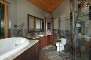 The tree that produced the white oak for the master bathroom previously grew in the same spot. "Deltec let me focus on areas I could figure out," says Sanders of his deep involvement with the project. "It was a great fit."