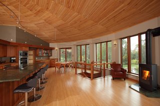 Founded in 1968, Deltec Homes is known for hurricane-resistant, energy-efficient homes, offered in round, traditional, and modern prefabricated kits. The round structure provides better airflow while reducing surface area, reducing heat gain and loss. "The shell is so efficient that we haven't turned on our central heating system for the main bulk of the winter in three years," says Sanders.