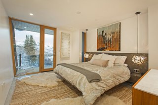 The master bedroom has access to a private terrace with alpine vistas.