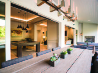How to Set the Stage For Outdoor Living With Scenic Doors - Photo 4 of 5 - A renovation in the Pacific Palisades neighborhood of Los Angeles connects the living and family rooms with a covered porch through a series of Ultimate Multi-Slide Doors.
