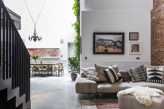 Stay in a Converted Victorian Cooperage in London - Photo 2 of 7 - Interior designer Andrea Larsson Sanchez complements the polished concrete floor, original Crittall windows, and exposed brick with contemporary furnishings and graphic textiles.