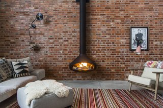 Stay in a Converted Victorian Cooperage in London - Photo 3 of 7 - A bespoke flue was manufactured for the wood-burning fireplace to reach the 10-meter ceiling height. 