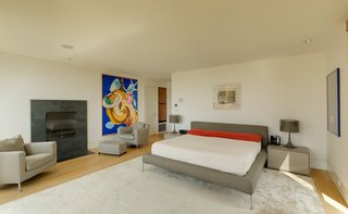 An Eliot Noyes Transformation in Connecticut Honors the Experimental Spirit of the Original - Photo 6 of 7 - On the second floor are two ensuite bedrooms and a master suite with a private balcony, gas fireplace, and dressing room. The separate pool house, which has stayed true to its 1950 footprint, boasts two other bedrooms.