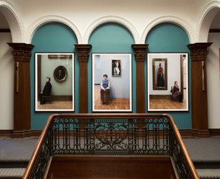 "Guardians" by Evie Simon and Stephanie Breitbard of Simon Breitbard Fine Arts elegantly graces the landing with Russian portraiture.