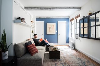 Big on Broadway, Small on Space: Inside the Studio of Actor Adam Kantor - Photo 1 of 5 - "My Resource Furniture system lets me hide the cumbersome qualities in an apartment," says Kantor. "It's a lot more elegant and opens up the space." Inspired to devise his own creative solutions, Kantor disguises his television with a mirror, creating the illusion of a larger room.