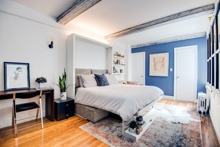 Big on Broadway, Small on Space: Inside the Studio of Actor Adam Kantor - Photo 4 of 5 - The modular unit comes in a three- or two-seat sofa version and integrates with closet and shelving systems. Kantor uses the space to display souvenirs from his travels.