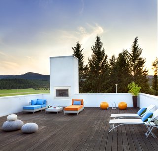 The spacious rooftop deck features Tigerwood planks and an outdoor fireplace, which creates a cozy setting from which to enjoy spectacular sunsets. There's also a wine fridge on the staircase leading to the deck—so you don't have to traipse back to the kitchen when you need another bottle.