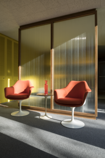 A Rare Midcentury Prefab Looks Just Like it Did in 1958—Down to the Knoll and Paul McCobb Interiors - Photo 11 of 13 - A pair of Saarinen Tulip Armchairs offers front-row seats to an ever-changing view from the bedroom, which benefits from floor-to-ceiling windows.