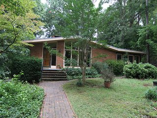 Elegantly Renovated, a Midcentury Home in Raleigh Asks $975K - Photo 1 of 13 - Before the renovation, 3322 Ocotea Street had a poorly built sunroom on the right side. 