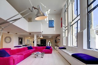 Traditional Churches Become Modern Homes - Photo 4 of 10 - Dating back to 1853, London’s Westbourne Grove Church was renovated by DOS Architects, who took on the top two floors turning them into a light-filled, open plan loft. The walls and floors might be white, but the furniture and furnishings are anything but.
