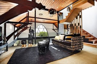 Traditional Churches Become Modern Homes - Photo 6 of 10 - An Anglican church in Melbourne dating back to 1892 was converted by Bagnato Architects to include a modern addition and interior renovation. Spread over multiple levels, the home features a variety of natural materials, like reclaimed wood, limestone, marble, and granite, giving the inside a warm and cozy feel.